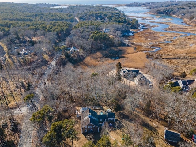 drone / aerial view featuring a water view and a view of trees