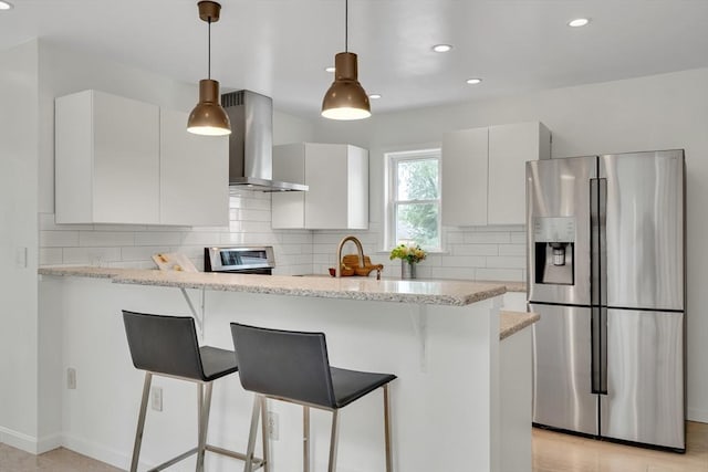 215 Norfolk St Unit 2, Cambridge, MA 02139 - kitchen featuring stainless steel refrigerator with ice dispenser, wall chimney range hood, a peninsula, a breakfast bar area, and recessed lighting