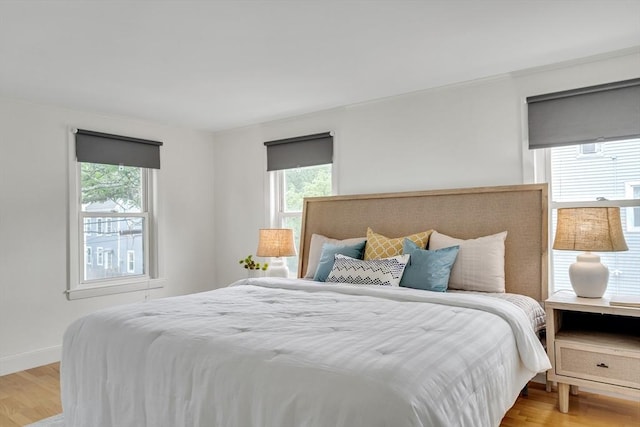 215 Norfolk St Unit 2, Cambridge, MA 02139 - bedroom with multiple windows and light wood-type flooring