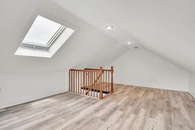 215 Norfolk St Unit 2, Cambridge, MA 02139 - additional living space featuring a skylight, lofted ceiling, and light wood-type flooring