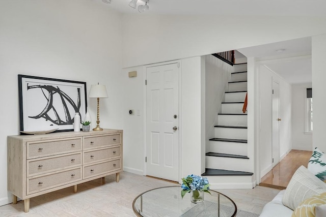215 Norfolk St Unit 2, Cambridge, MA 02139 - entryway featuring stairs, light wood finished floors, and vaulted ceiling