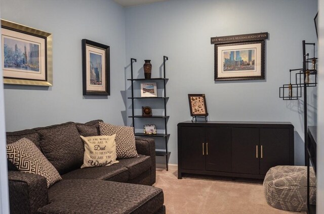 living area featuring light carpet