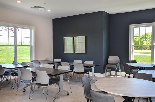 dining room featuring a healthy amount of sunlight, recessed lighting, and visible vents
