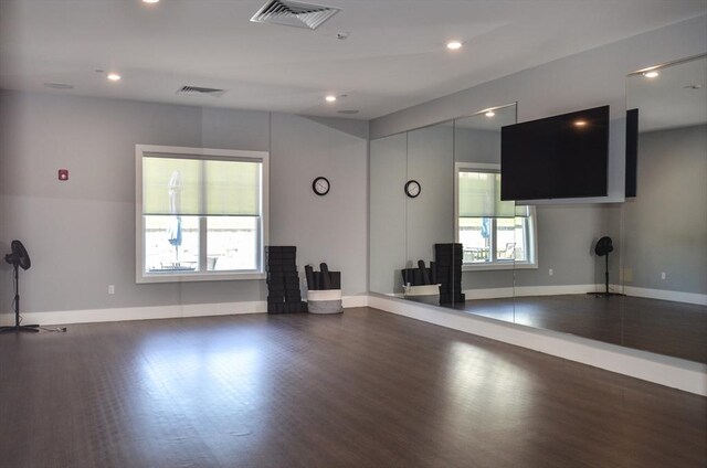 interior space with visible vents, recessed lighting, baseboards, and wood finished floors