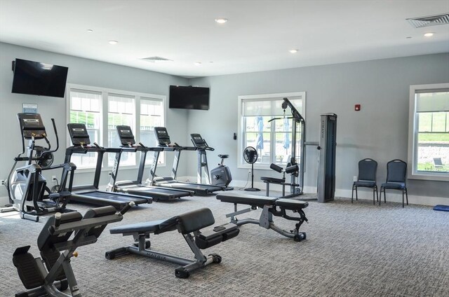 workout area with a healthy amount of sunlight, carpet floors, recessed lighting, and visible vents
