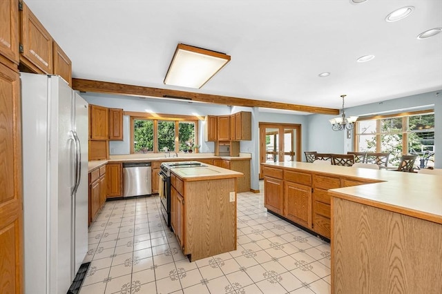 8 Horseshoe Dr, Acton, MA 01720 - kitchen featuring freestanding refrigerator, dishwasher, black electric range, a center island, and light countertops