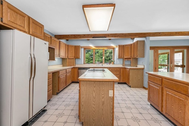 8 Horseshoe Dr, Acton, MA 01720 - kitchen with freestanding refrigerator, light floors, a center island, light countertops, and stainless steel dishwasher