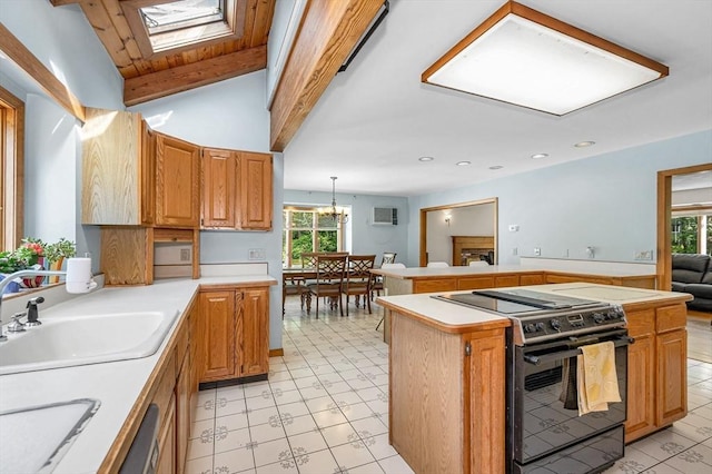 8 Horseshoe Dr, Acton, MA 01720 - kitchen with electric range, light countertops, a skylight, a chandelier, and recessed lighting