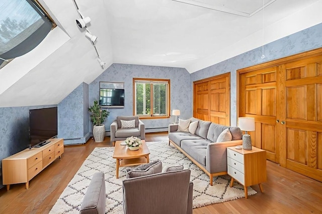 8 Horseshoe Dr, Acton, MA 01720 - living area featuring wallpapered walls, lofted ceiling, wood finished floors, rail lighting, and attic access