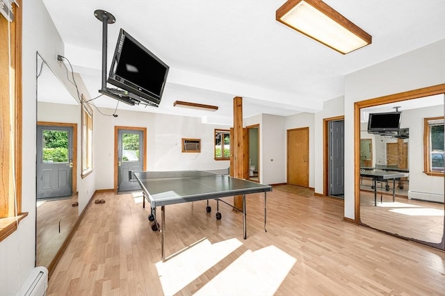8 Horseshoe Dr, Acton, MA 01720 - game room with a baseboard heating unit, light wood-type flooring, and a wall mounted AC