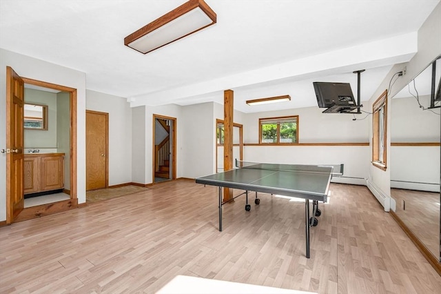 8 Horseshoe Dr, Acton, MA 01720 - recreation room featuring light wood-type flooring and a baseboard radiator