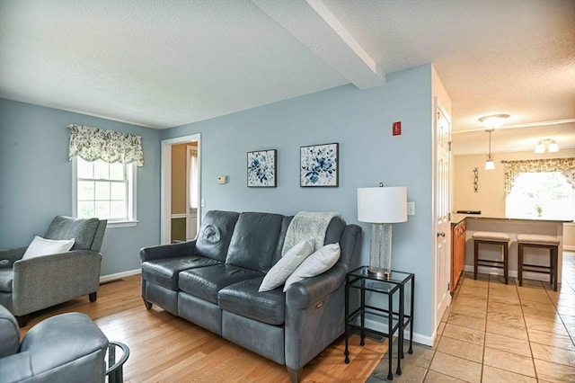 20 Bowdoin Dr, Haverhill, MA 01830 - living area with a textured ceiling and plenty of natural light