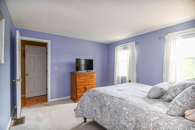 20 Bowdoin Dr, Haverhill, MA 01830 - bedroom featuring light colored carpet and a textured ceiling