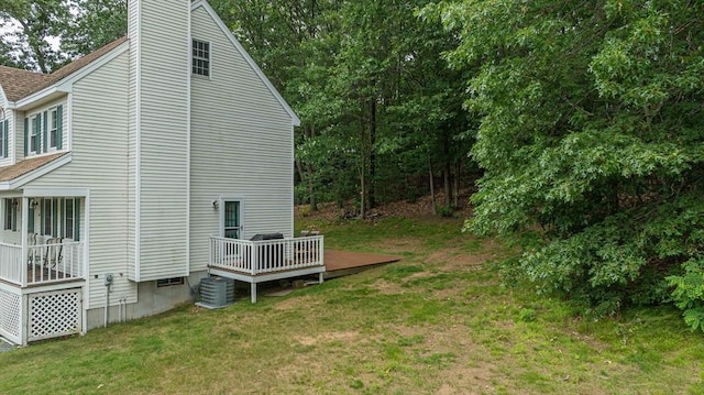 20 Bowdoin Dr, Haverhill, MA 01830 - view of side of property featuring a deck, a yard, a shingled roof, and a chimney