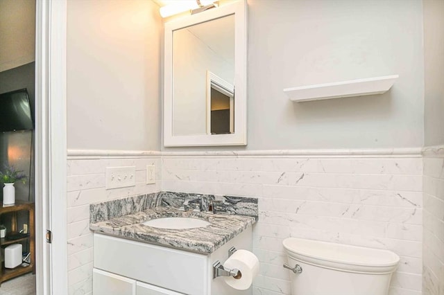 20 Bowdoin Dr, Haverhill, MA 01830 - bathroom with tile walls, vanity, and wainscoting