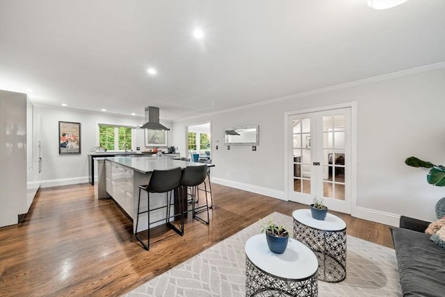 176 Spring St, Hopkinton, MA 01748 - living area featuring crown molding, french doors, baseboards, dark wood-style floors, and recessed lighting