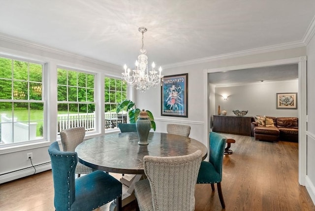 176 Spring St, Hopkinton, MA 01748 - dining room with healthy amount of natural light, a chandelier, baseboard heating, wood finished floors, and crown molding
