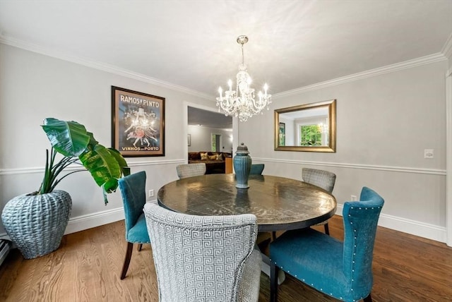 176 Spring St, Hopkinton, MA 01748 - dining area featuring a chandelier, wood finished floors, crown molding, and baseboards