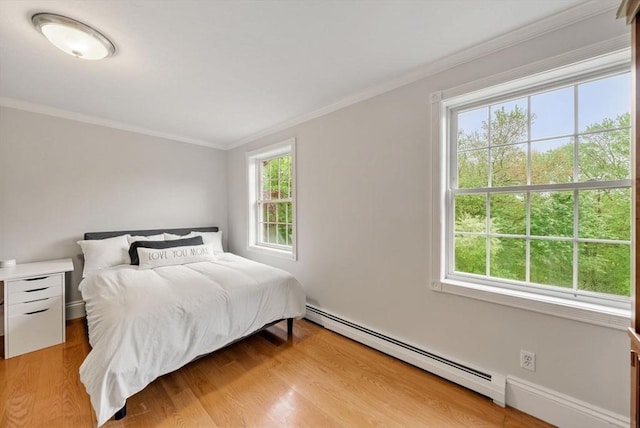 176 Spring St, Hopkinton, MA 01748 - bedroom featuring a baseboard radiator, ornamental molding, light wood-style floors, and baseboards
