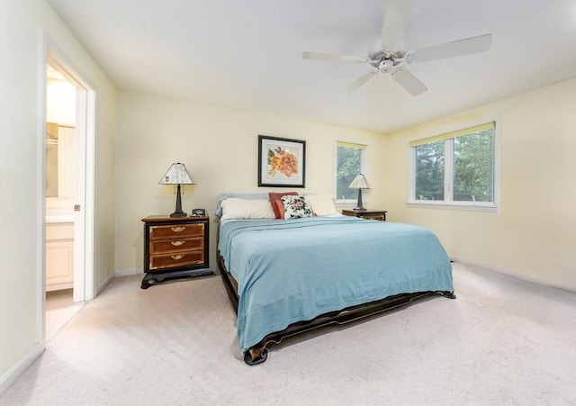37 Pine Hill Blvd Unit 30, Mashpee, MA 02649 - bedroom with light colored carpet, a ceiling fan, and ensuite bathroom