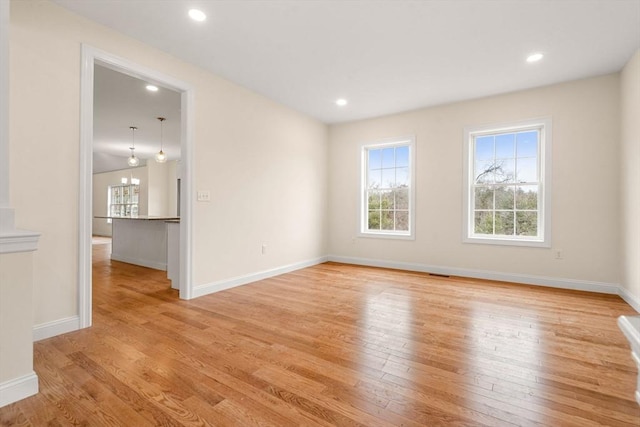 66-3 Parish Rd, Georgetown, MA 01833 - empty room with healthy amount of natural light, light wood-type flooring, baseboards, and recessed lighting