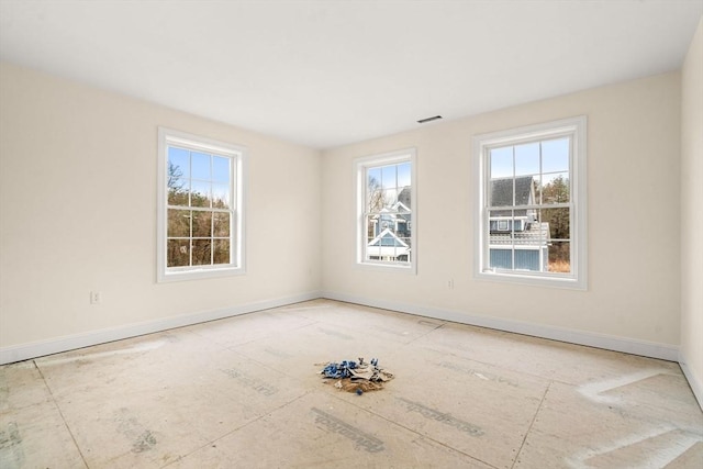 66-3 Parish Rd, Georgetown, MA 01833 - empty room featuring plenty of natural light and baseboards