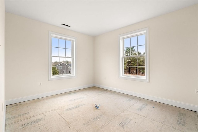 66-3 Parish Rd, Georgetown, MA 01833 - empty room featuring healthy amount of natural light and baseboards