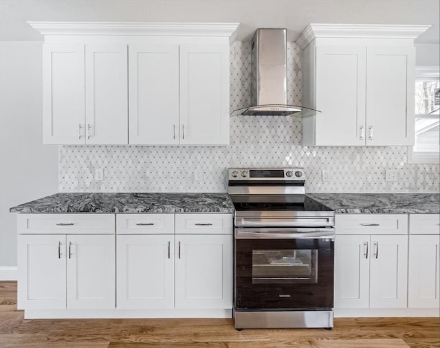 kitchen with white cabinetry, stainless steel electric range oven, and wall chimney exhaust hood