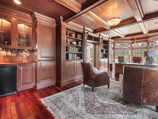 office area with ornamental molding, beamed ceiling, coffered ceiling, and dark wood finished floors