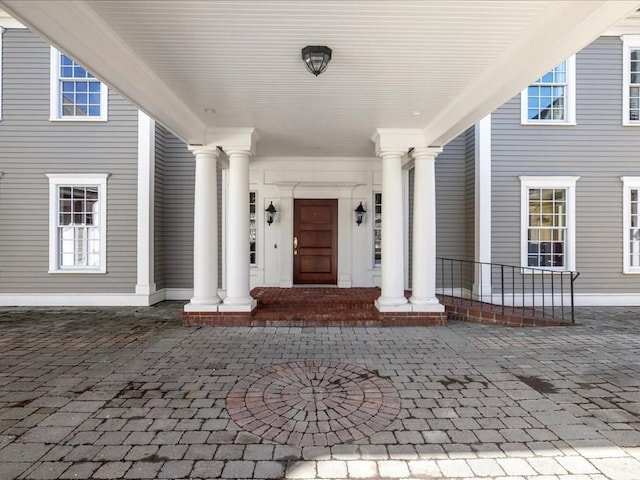 doorway to property featuring covered porch