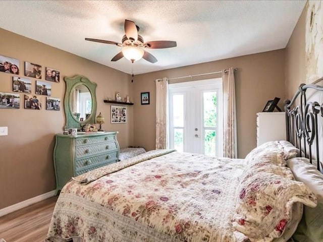 1244 Corktree E, Port Charlotte, FL 33952 - bedroom with multiple windows, light wood finished floors, a ceiling fan, and a textured ceiling