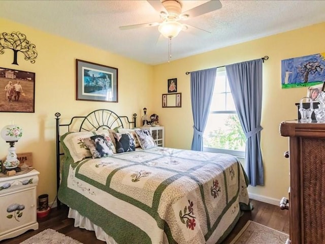 1244 Corktree E, Port Charlotte, FL 33952 - bedroom with dark wood-style flooring, ceiling fan, and a textured ceiling
