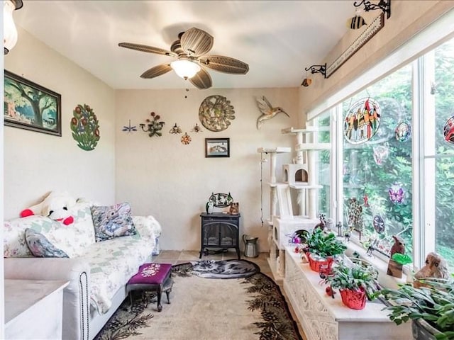 1244 Corktree E, Port Charlotte, FL 33952 - living room with a wood stove and a ceiling fan