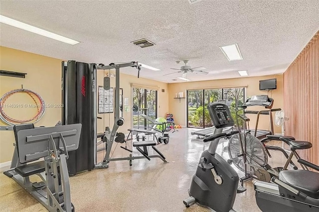 1244 Corktree E, Port Charlotte, FL 33952 - exercise room with a textured ceiling and a ceiling fan