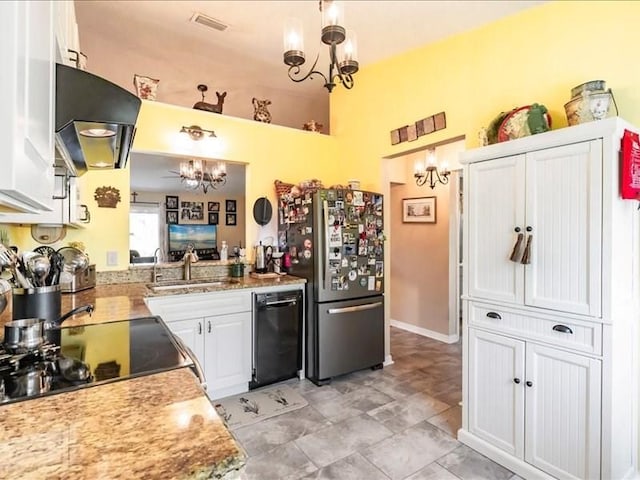 1244 Corktree E, Port Charlotte, FL 33952 - kitchen with freestanding refrigerator, range hood, black dishwasher, white cabinets, and a chandelier