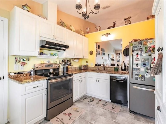 1244 Corktree E, Port Charlotte, FL 33952 - kitchen with appliances with stainless steel finishes, under cabinet range hood, white cabinets, dark stone counters, and a chandelier