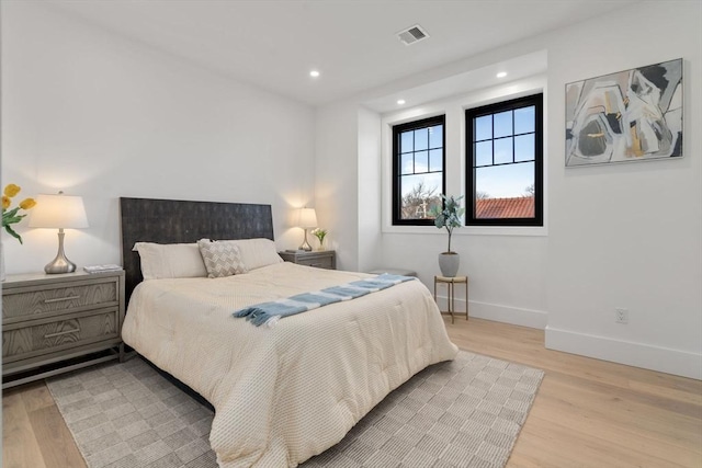 bedroom with light wood-type flooring