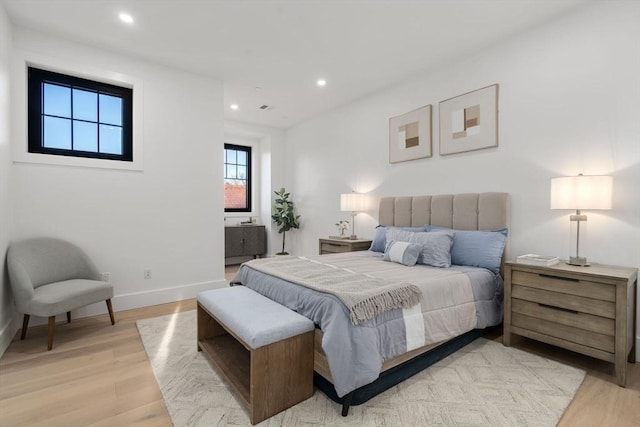 bedroom with light hardwood / wood-style flooring