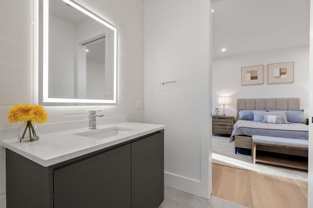 bathroom with hardwood / wood-style flooring and vanity