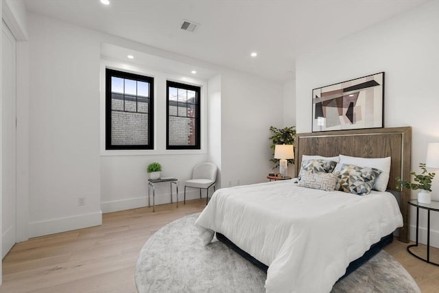 bedroom with light hardwood / wood-style floors