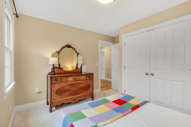 15 Sylvan Dr, Stow, MA 01775 - bedroom with light colored carpet, baseboards, and a closet