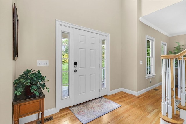 15 Sylvan Dr, Stow, MA 01775 - foyer entrance featuring baseboards, light wood finished floors, ornamental molding, and stairs