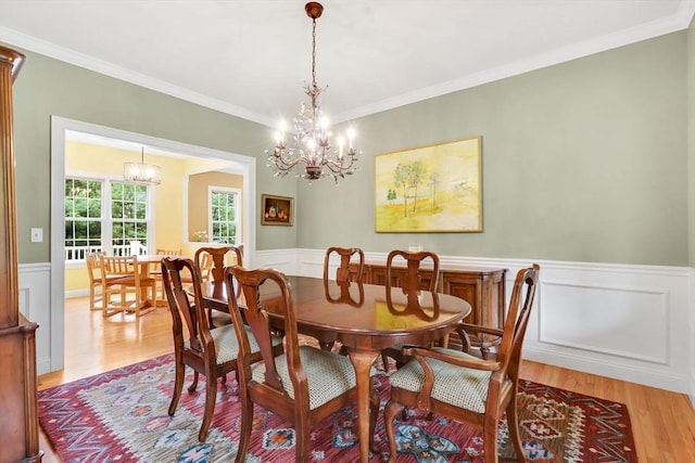 15 Sylvan Dr, Stow, MA 01775 - dining room featuring light wood finished floors, wainscoting, a chandelier, and ornamental molding