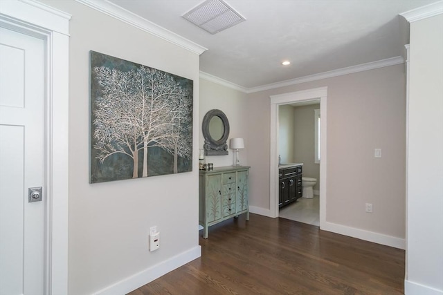 spare room featuring baseboards, crown molding, dark wood-type flooring, and recessed lighting