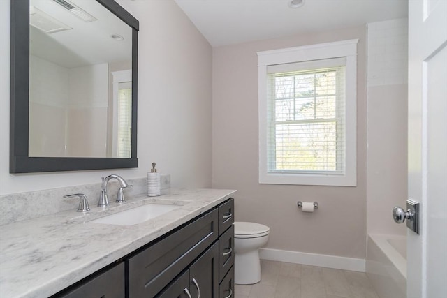 full bath featuring baseboards, vanity, and toilet