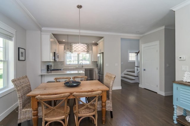dining area featuring dark wood-style floors, baseboards, stairs, and crown molding