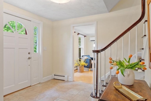 163 Candlestick Rd, North Andover, MA 01845 - entryway featuring a baseboard radiator, stairway, a wall mounted air conditioner, light tile patterned floors, and baseboards