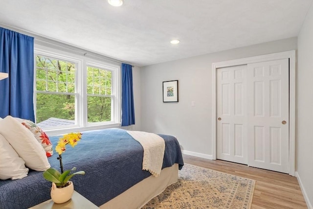 163 Candlestick Rd, North Andover, MA 01845 - bedroom with baseboards, wood finished floors, recessed lighting, and a closet