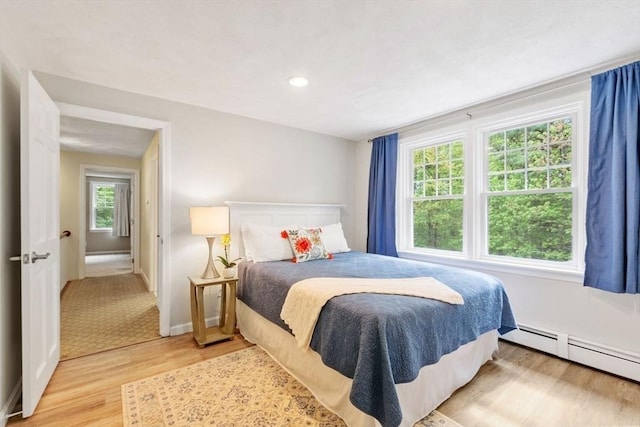 163 Candlestick Rd, North Andover, MA 01845 - bedroom with light wood-type flooring, baseboard heating, baseboards, and recessed lighting