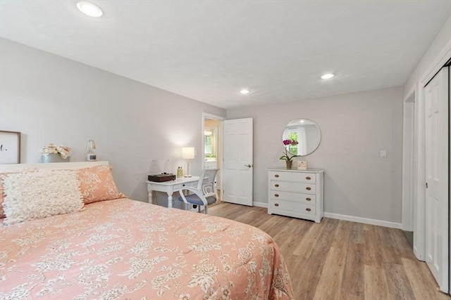 163 Candlestick Rd, North Andover, MA 01845 - bedroom featuring light wood-type flooring, baseboards, recessed lighting, and a closet